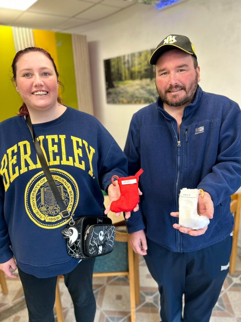 Two service users and their Christmas Stocking Crafts